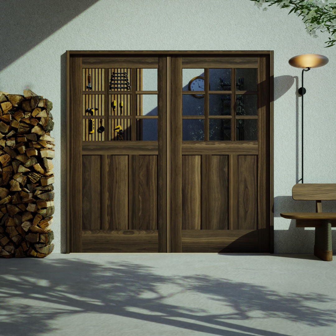 Ballard Walnut Wood Carriage Doors with Nine individual glass panes on a garage space next to a bench