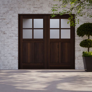 Bellingham Carriage Style Garage Doors with four glass panes on a white brick wall