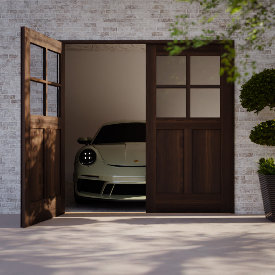 Solid Wood Carriage Door opening to a Porshe car on a white brick wall