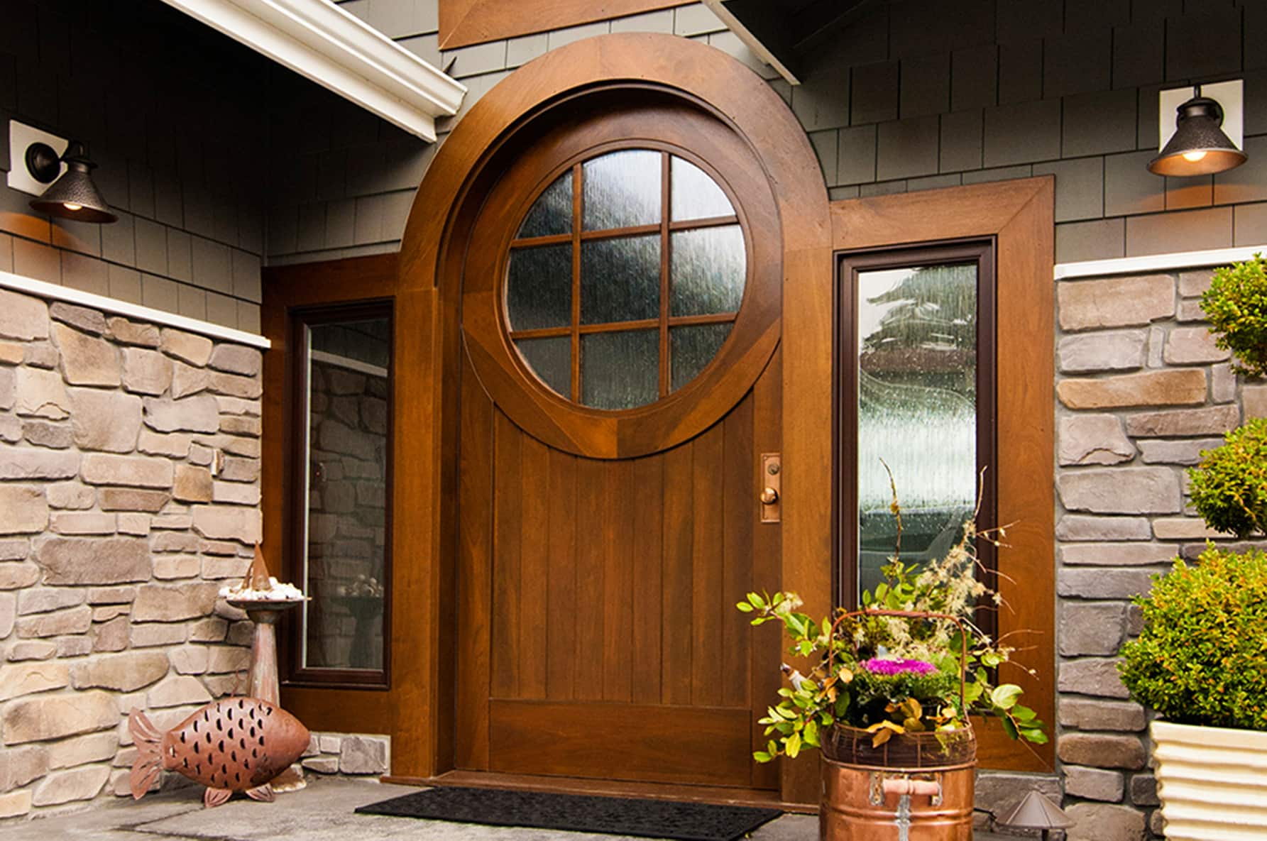 Custom arched front door with side lights