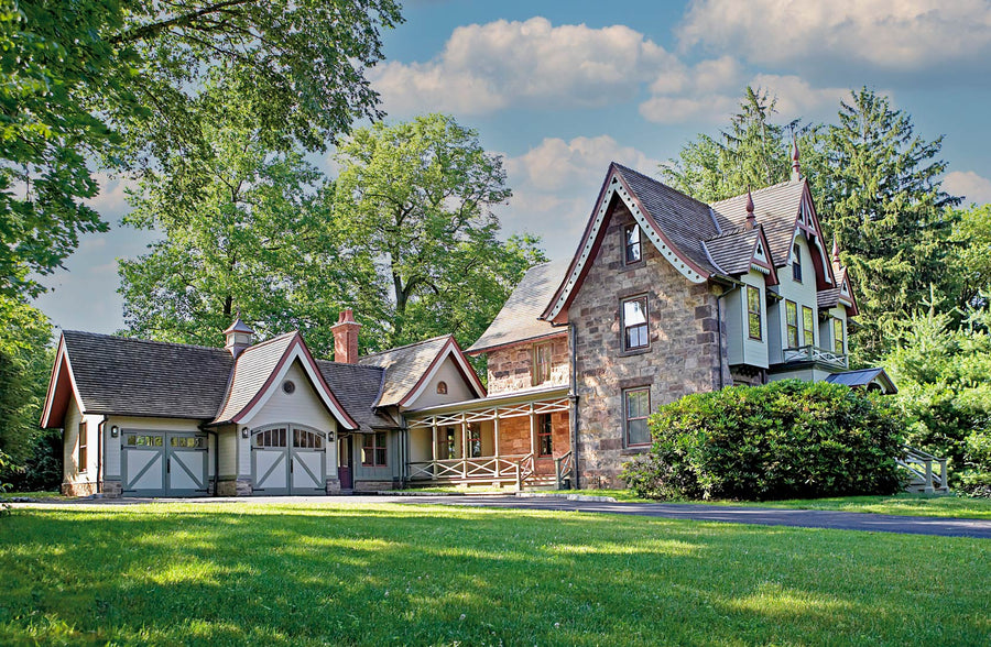 Large house with two sets of green carriage doors