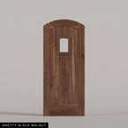 Modena arched door in Knotty Black Walnut, with vertical wood planks and a small arched-top window. Labeled wood species view.