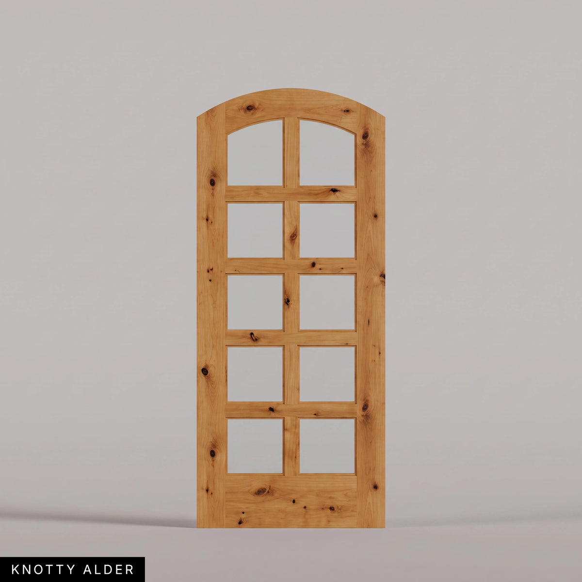 Padua arched door in Knotty Alder, with ten glass panes in two columns. Labeled wood species view.