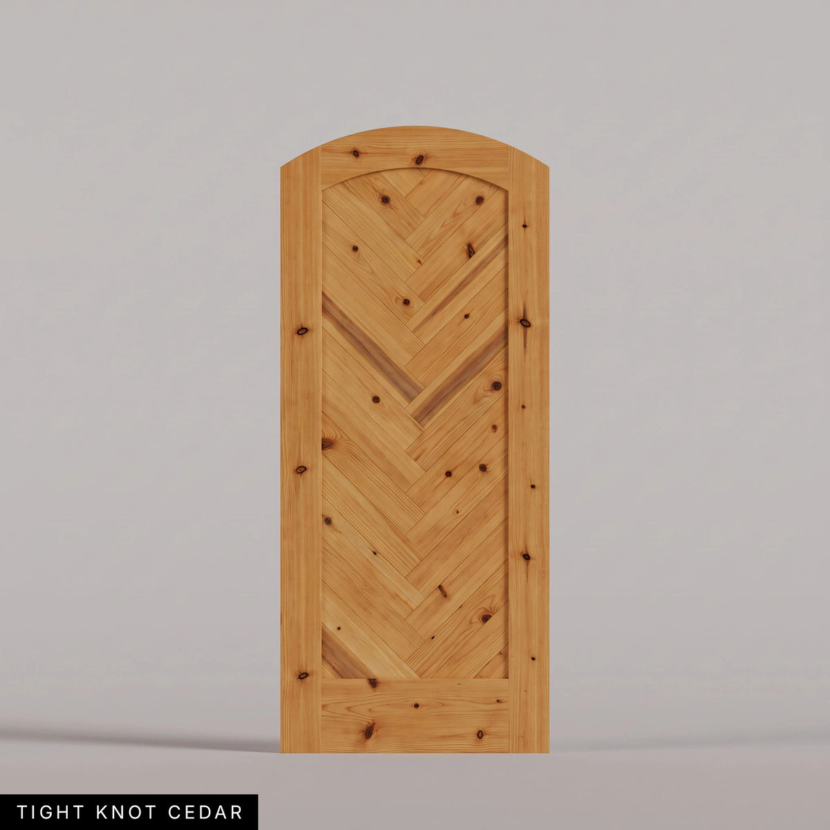 Palermo arched door in Tight Knot Cedar, with a downward-pointing herringbone pattern. Labeled wood species view.