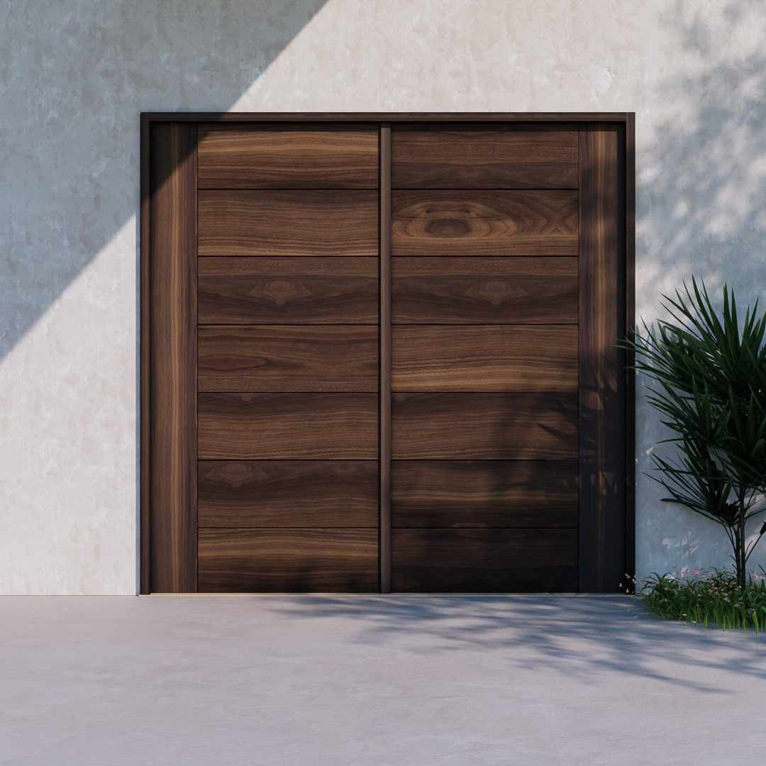 Peninsula Modern Wood Carriage doors on a concrete wall next to a palm plant