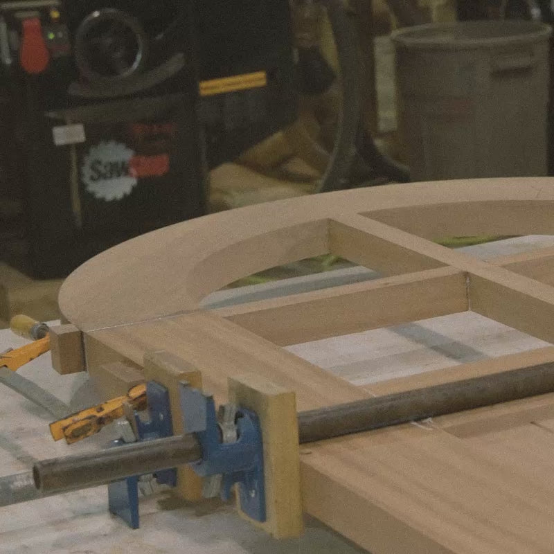 The process of handcrafting a wooden arch Top Door