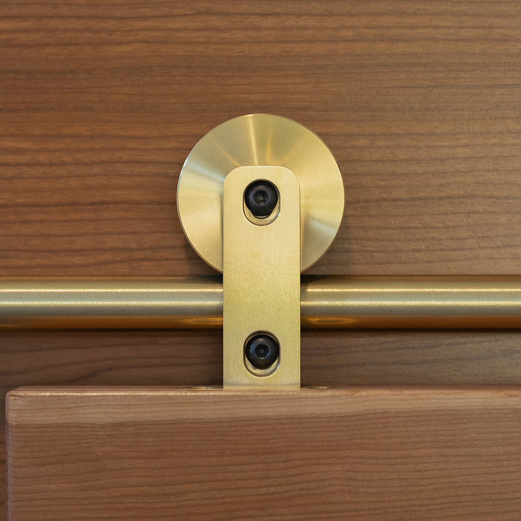 Swiss Rod brass hangers shown in context on Walnut door