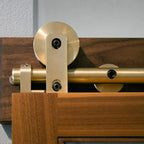 Swiss Rod brass hangers closeup in context