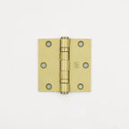 Brass door hinge on a white background