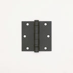 Black metal hinge on a white background