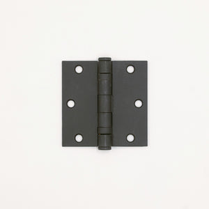 Black metal hinge on a white background