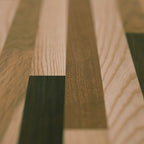 Red Roan countertop closeup featuring Walnut, Padauk, and Ash pieces