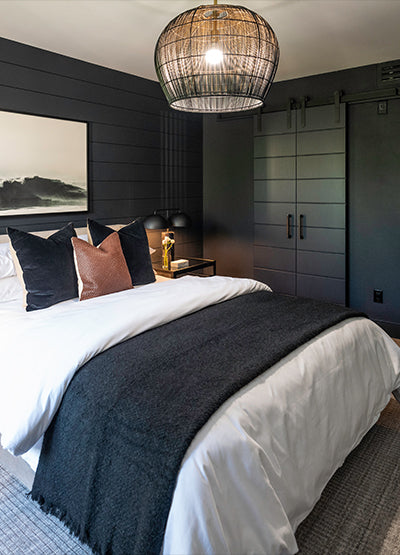 Luxurious bedroom with black double barn doors