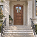 RealCraft Murano Black Walnut arched entry door with tall upper glass lites and lower wood panels at a Chicago-inspired limestone porch.