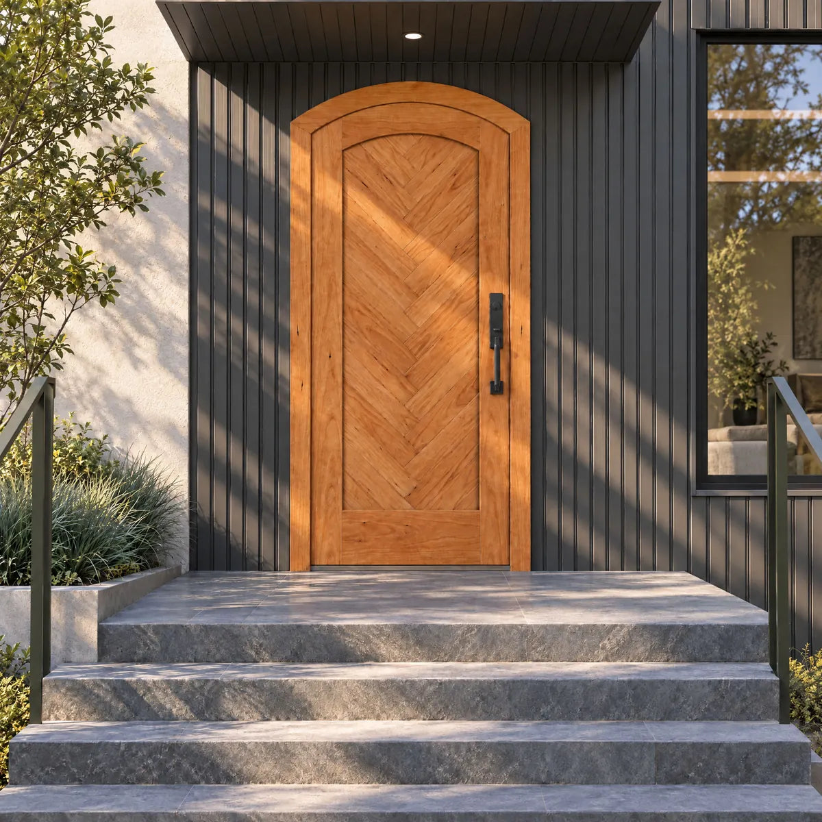 RealCraft Palermo Cherry arched entry door with chevron wood boards beneath a New York-inspired dark metal townhouse canopy.