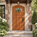 RealCraft Rialto arched door in Sapele Mahogany, beneath a timber canopy on stone corbels with a hanging lantern.