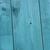Blue weathered wood barn door closeup 