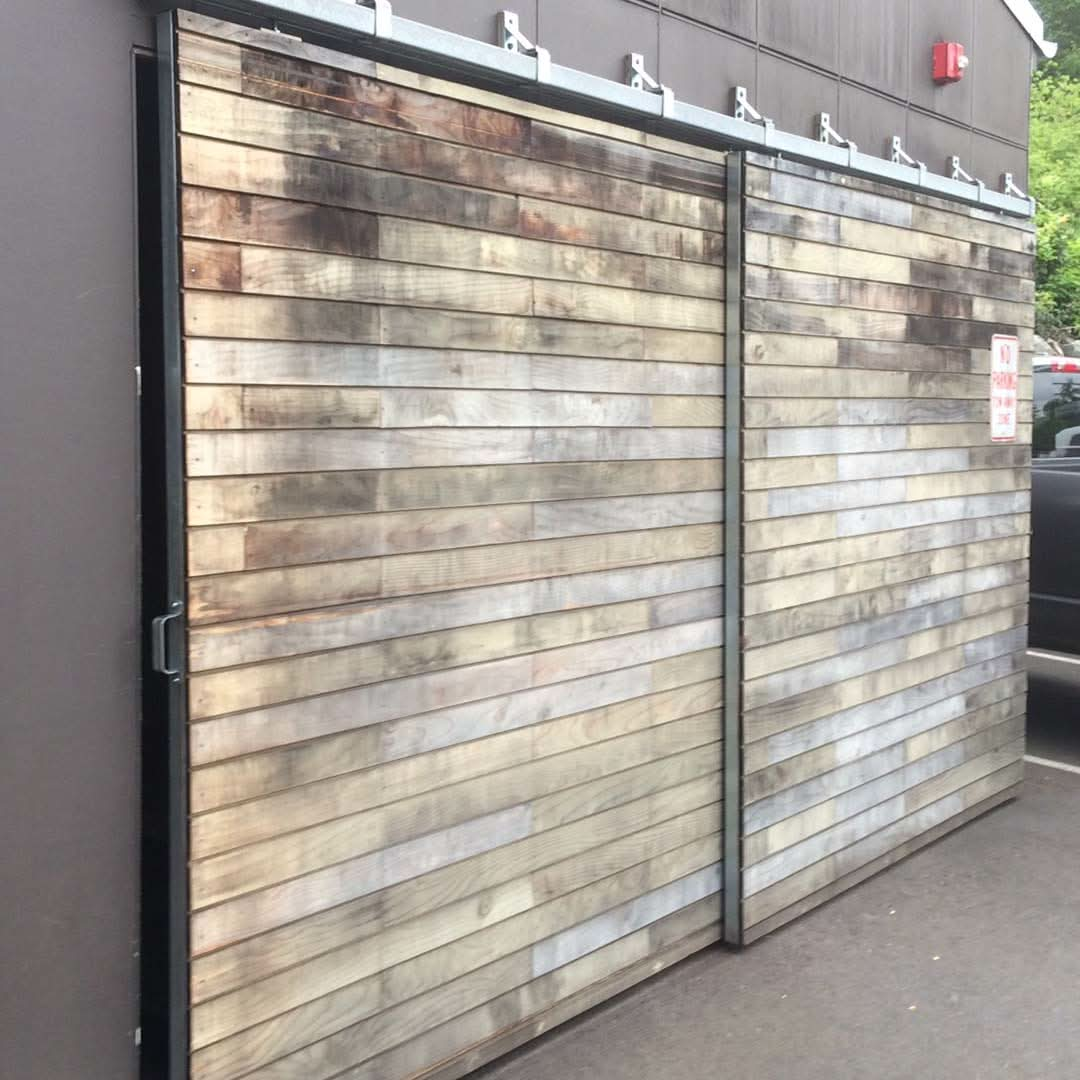 Galvanized Box Rail 400lb Bypass installed in an exterior garage