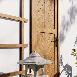 White Oak Chevron Four Panel Solid Core Exterior Front Door in a garden area