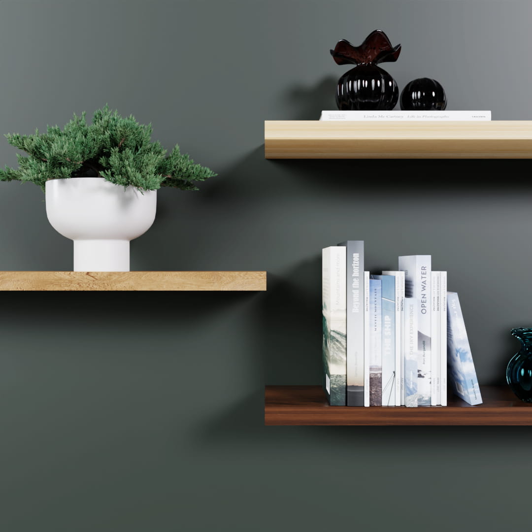 Three floating wood shelves on a green wall