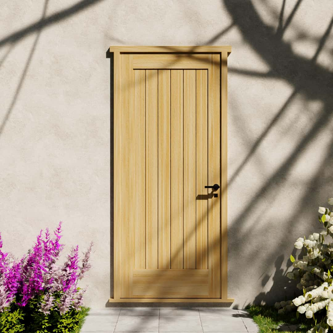 Maple Wood Modern Flush Plank Solid Core Exterior Front Door next to white and pink flower bushes