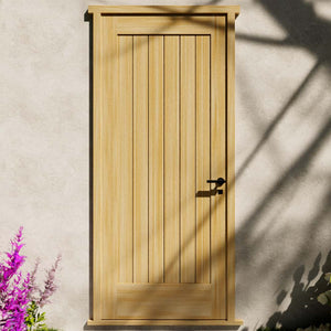 Maple Wood Modern Flush Plank Solid Core Exterior Front Door next to pink flower bushes