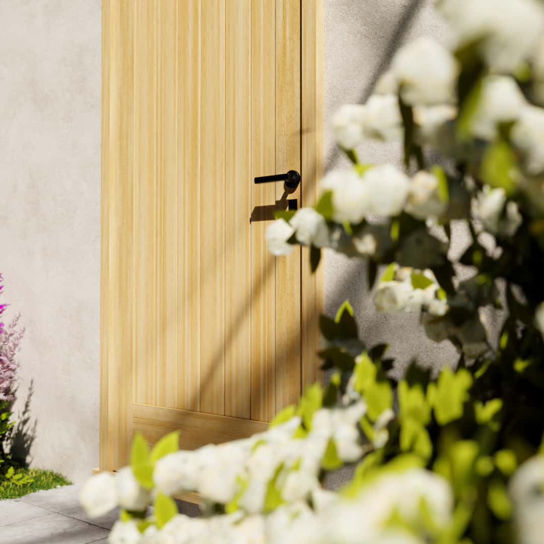 Maple Wood Modern Flush Plank Solid Core Exterior Front Door next to white flower bushes