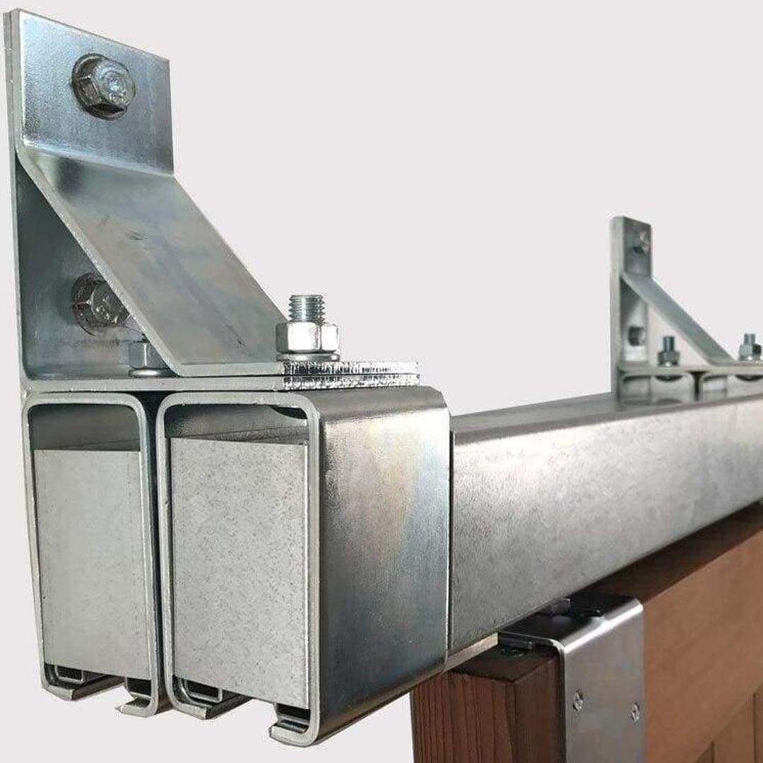 Galvanized Box Rail 600lb Bypass Hardware installed on brown barn door