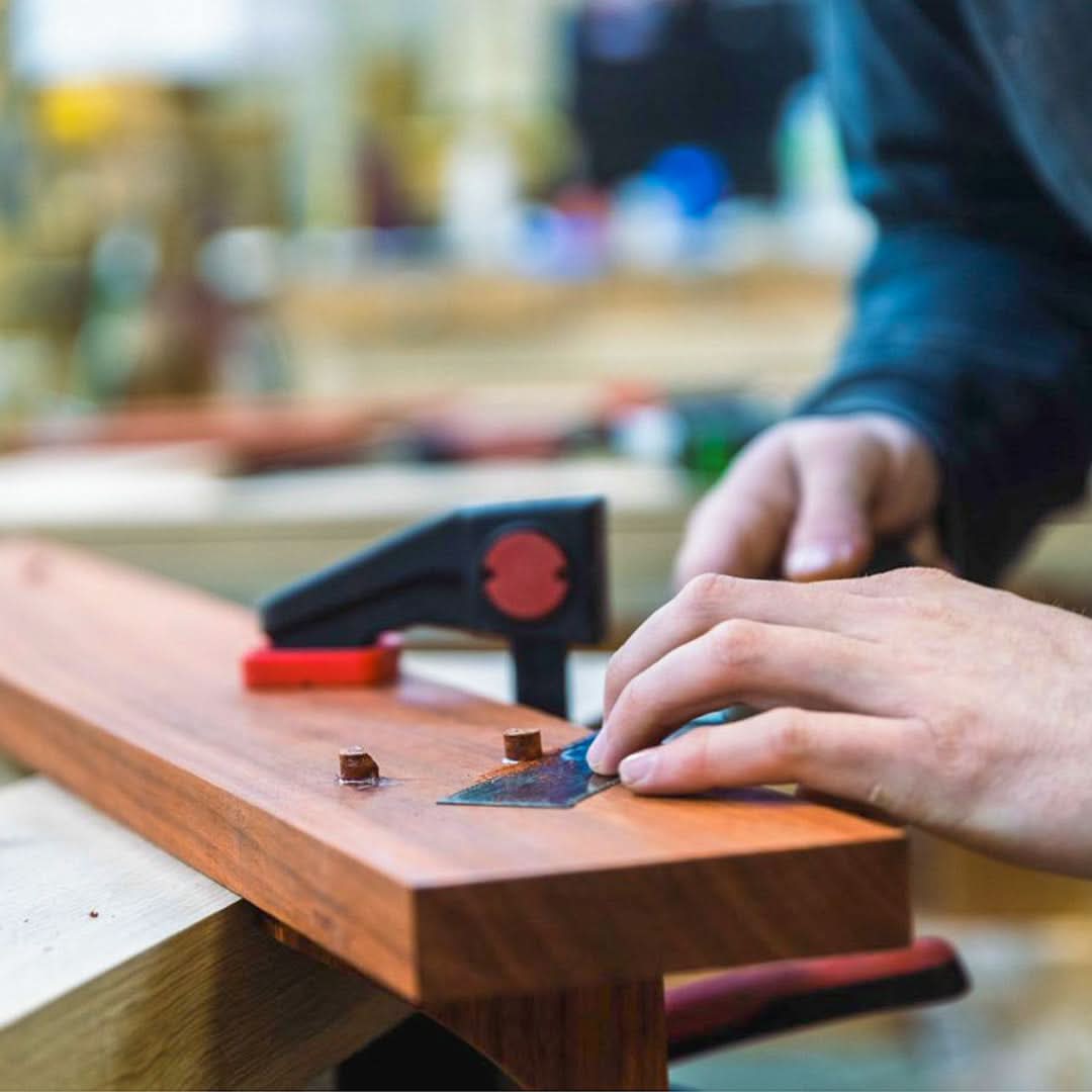 Craftsman working on a dutch door shelf