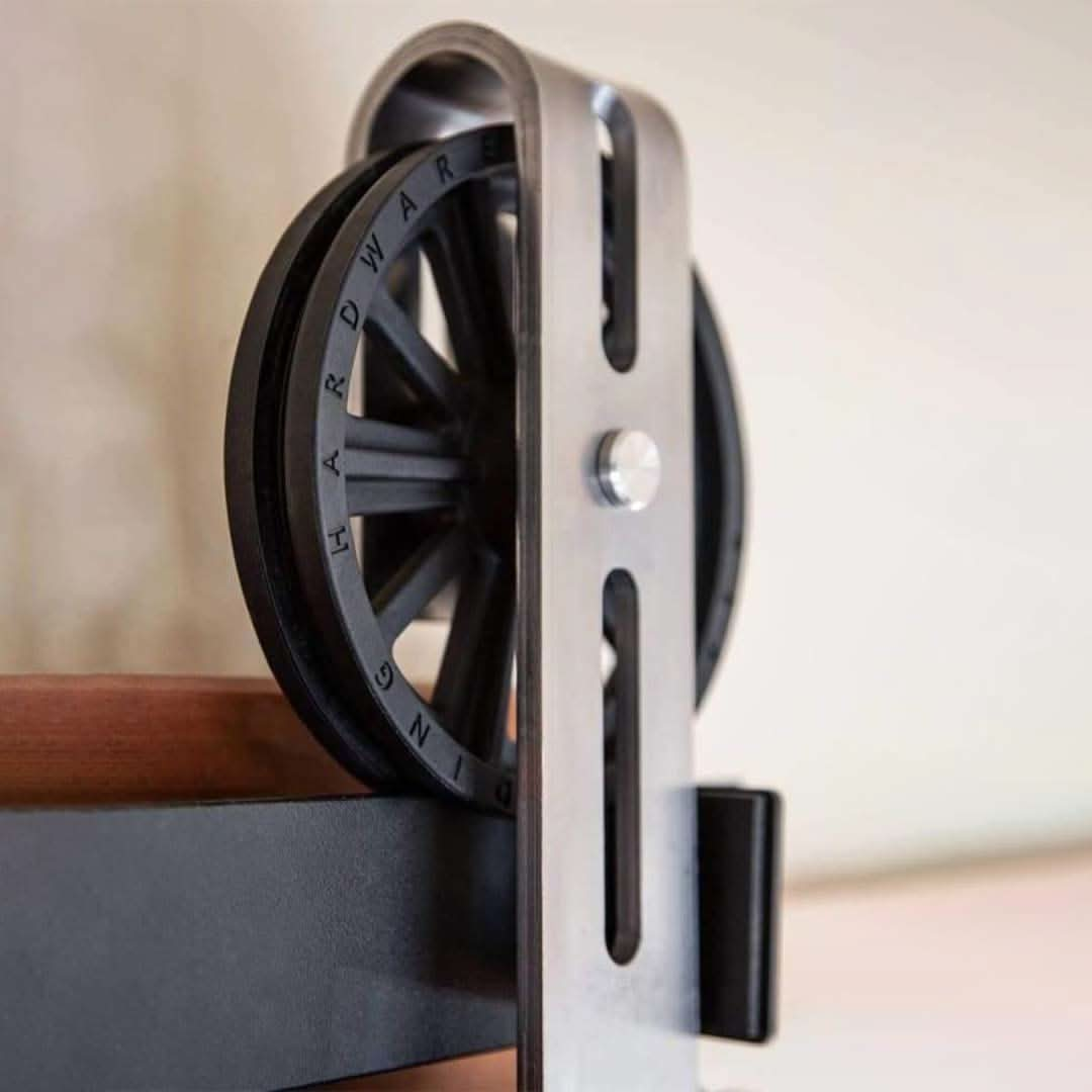 Close up shot of the wheel area of a Big Spoke Wheel Barn Door Hardware