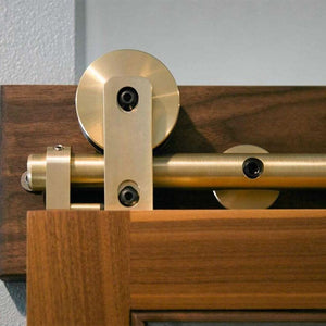 Swiss Rod Brass Sliding Barn Door Hardware Kit - Sliding Barn Door Hardware installed on sapele mahogany door.