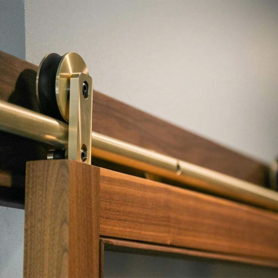 Swiss Rod Brass Sliding Barn Door Hardware Kit - Sliding Barn Door Hardware installed on sapele mahogany door.