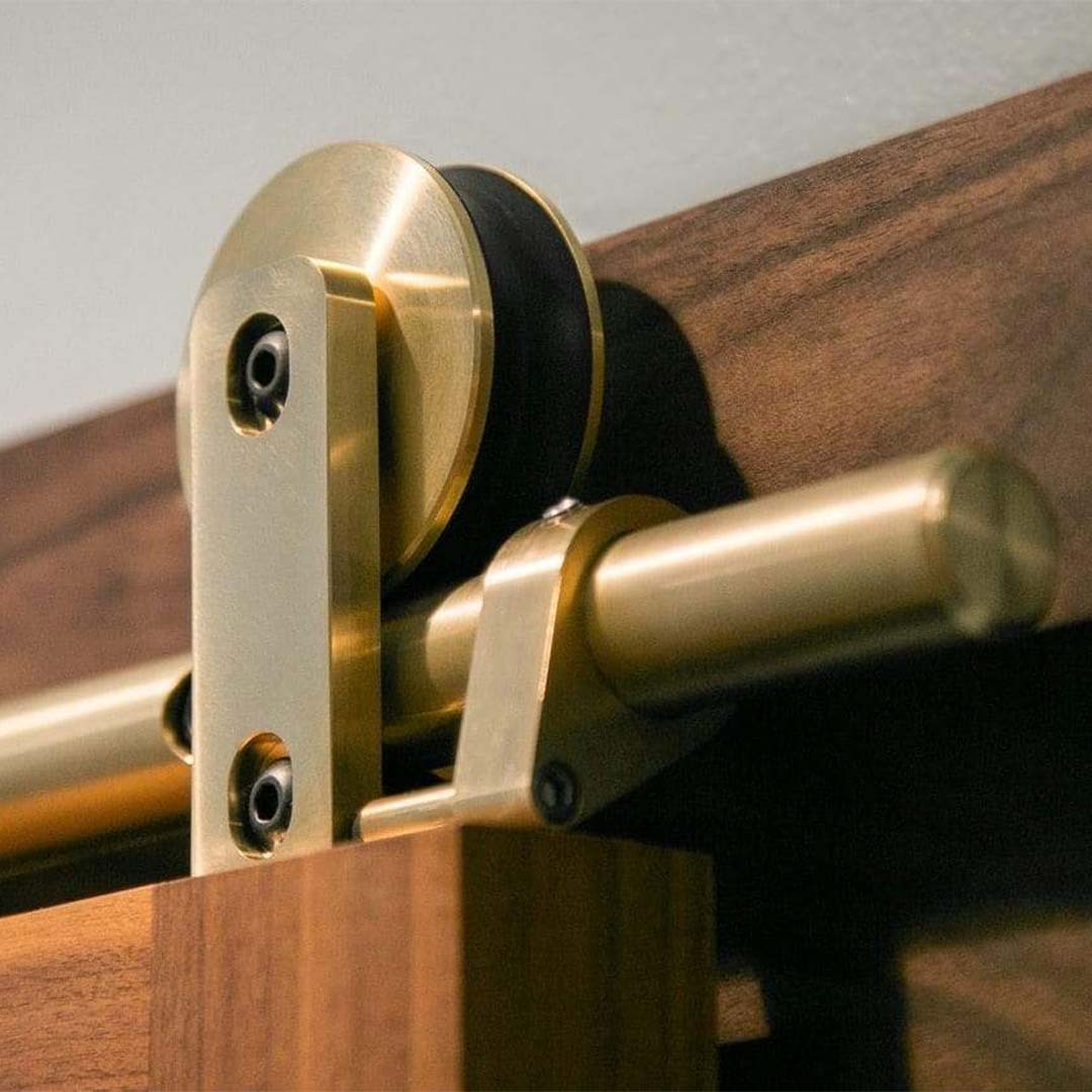 Swiss Rod Brass Sliding Barn Door Hardware Kit - Sliding Barn Door Hardware installed on sapele mahogany door.